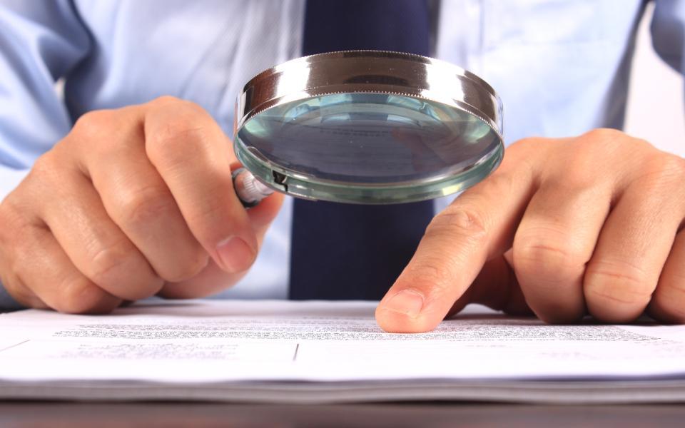 North Carolina general contractor reviewing a hold harmless agreement construction contract before signing